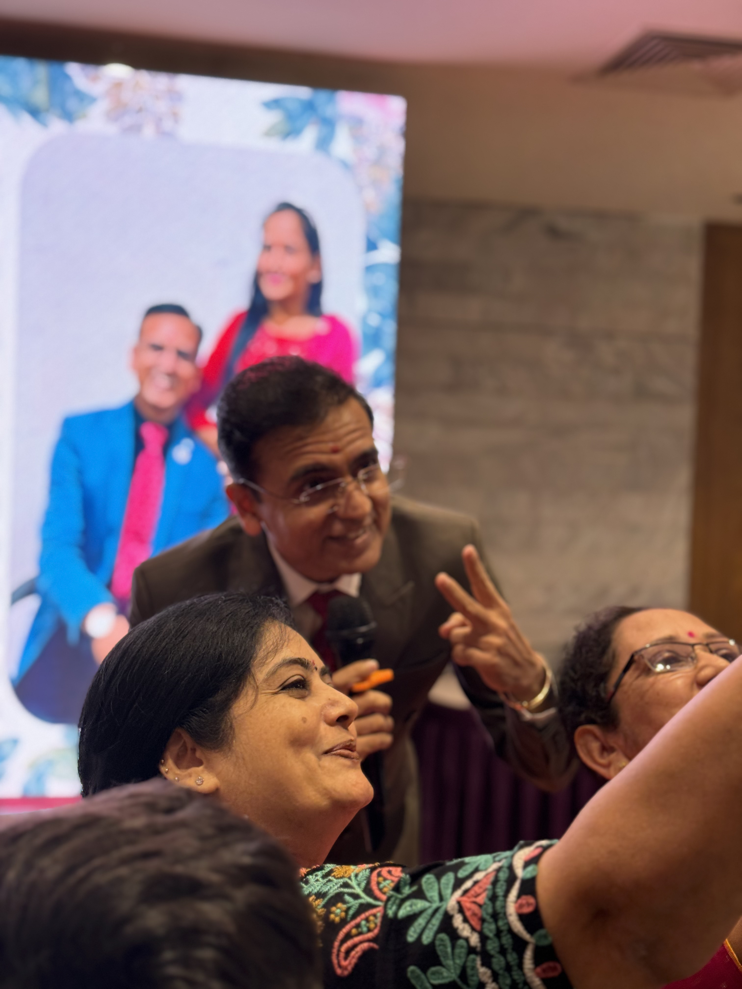 Amit Sarvaiya greeting community members closely at an in-person event